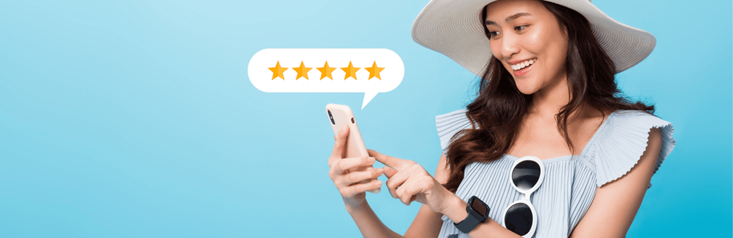 Beautiful young woman touch smart mobile phone in vacation isolated on blue background, girl car rental review on smartphone in travel summer trip